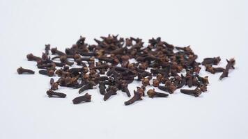 Scattered Dried Cloves Spice Isolated on White Background photo