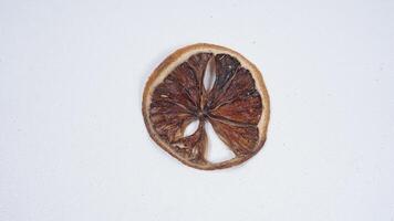 Delicious Dried Lemon Slice on White Background photo