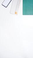 Work Tools with Mobile Phone on White Background photo