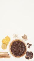 Cinnamon, Dried Turmeric and Lemon, Star Anise, Cardamom, Coriander,and Cloves Isoaled on Light Background photo