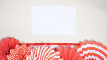 Independence Day of Indonesia Concept with A Blank Sheet of Paper for Copy Space on Light Background photo