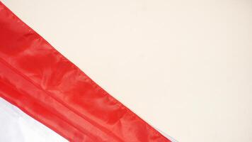 Independence Day of Indonesia Concept with Red and White Flag and Copy Space Area on Light Background photo