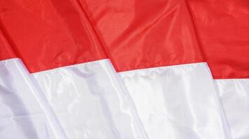 Red and White National Flag of Indonesia as Background for Copy Space photo