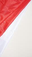 Independence Day of Indonesia Concept with Red and White Flag on Light Background photo