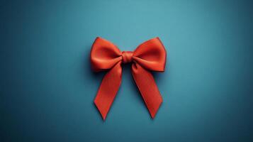 A red bow on a blue background photo