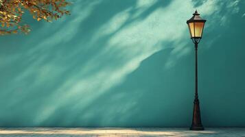 An old street lamp is sitting in front of a blue wall photo