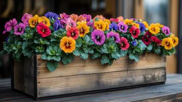 A wooden planter with colorful flowers on it photo