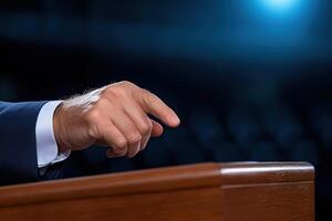 hand of a speaker while speaking at the tribune, pointing his finger at the audience photo