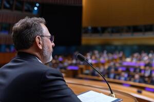 Speaker giving a speech at the conference photo