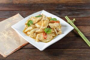 A plate of food with a fork and a napkin photo