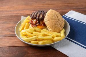 A plate with a burger and french fries photo