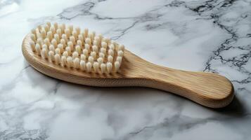 Natural bamboo toothbrush on a marble surface with bristles ready for use during daily dental care routine photo