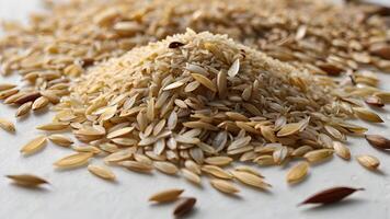 Close Up of Scattered Rice Grains on White Surface photo
