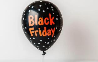 Black Friday balloon with polka dots in a minimal setting photo