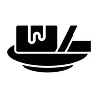 A black and white icon of a plate with a fork and knife vector