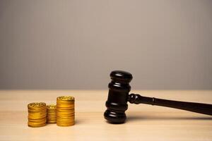 Judge's gavel and stack of coins. Litigation photo