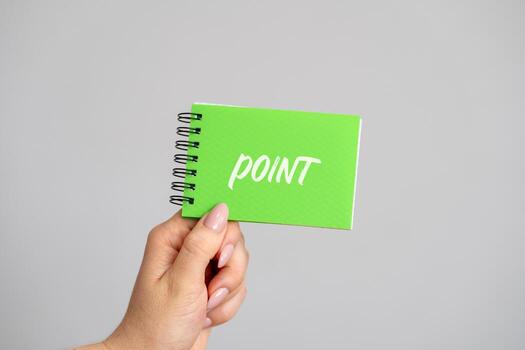 Notebook with the word Point in female hands. Point or destination. Gist business concept photo