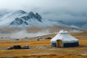 Traditional mongolian yurt in autumn landscape with grazing yaks photo