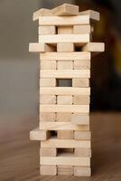 A wooden tower with many blocks stacked on top of each other photo