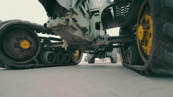 Tractor wheels and transmission operation. View of the tractor from below. Repair of large dimensional equipment. video