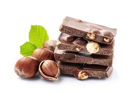 Chocolate with hazelnuts nuts on white backgrounds photo
