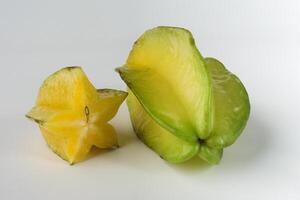 Fresh Sliced Starfruit Displayed Against a Clean White Background photo