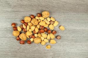 Assorted mixed nuts on white background almond hazelnut walnut photo
