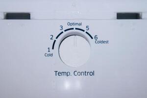 Refrigerator temperature control knob to adjust the level of coldness photo