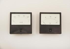 Voltmeter and ammeter on a white background. means of measuring electric current and voltage. photo