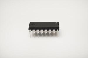 A microcircuit on white background. A computer chip. A component of semiconductor devices. photo