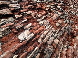 ERODED RED BRICK WALL photo