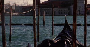 Gondola In Venice Floating By A Dock In The Afternoon video