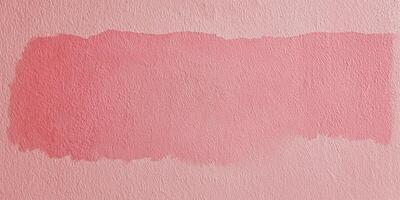 pink paint on a wall with a white background photo