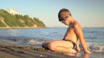 Child enjoying summer holidays and relaxing at the seaside video