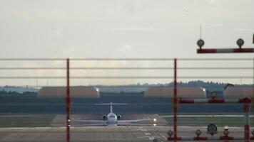 Long shot front view of an airplane gaining speed and taking off. Plane departure. video