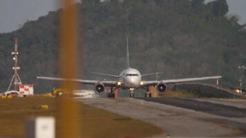 Emergency plane and fire truck on the taxiway. Preparing for the evacuation of passengers from an airliner. Fire of the right landing gear, engine surging. Interrupted flight video