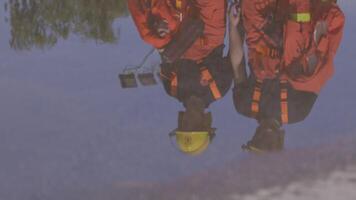 A group of prepared firefighters stands ready for hazardous tasks involving rescuing victims and extinguishing fires, exemplifying their dedication and bravery in the face of emergencies video