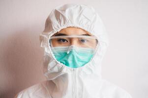 Portrait of healthcare worker wearing PPE suit for working in hospital during covid-19 pandemic. photo
