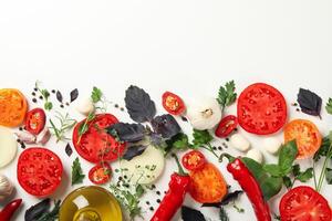 Different herbs and spices on white background, top view photo