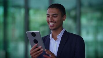 A person on a call using a tablet, showing interest and attentiveness in communication video
