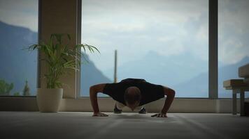 A person does pushups with a stunning mountain view, merging physical effort and nature video