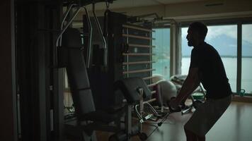 Individual Engaging in Physical Training at a Contemporary Fitness Center with Beautiful Views video