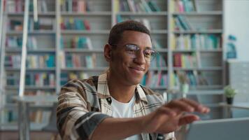 African American man guy student e-learning finish stop task done high school online laptop computer gadget smile educate internet completion work achievement deadline pride library happy male study video