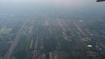 Passenger airplane flying over the city, top view from the window. Airliner in the sky, POV view video