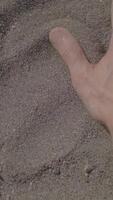 A Hand Imprint in the Soft Sand on the Beautiful Beach, Capturing a Moment of Serenity video