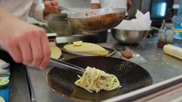 Plating Italian Spaghetti Pasta With Clams On A Black Plate For A Restaurant video