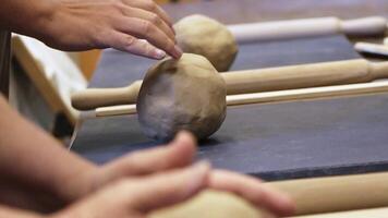 In this engaging workshop, hands skillfully shape clay during an insightful pottery craft session. Stock Clip video