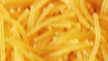 Background of Uncooked Noodles Moving Up - Top View, Close Up. Raw Pasta in Move. Texture of Dry Vermicelli video