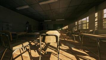 Abandoned school classroom with empty desks and sunlight streaming in video