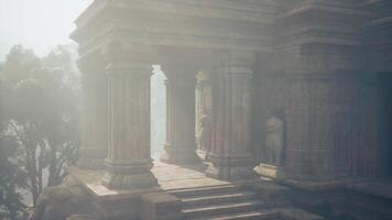 Ancient temple ruins shrouded in mist within Myanmars dense jungle video